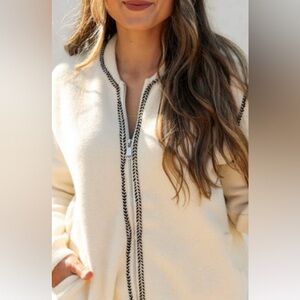 Cream cardigan with black trim